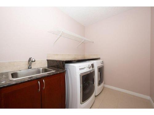 15 Cougar Ridge Rise Sw, Calgary, AB - Indoor Photo Showing Laundry Room