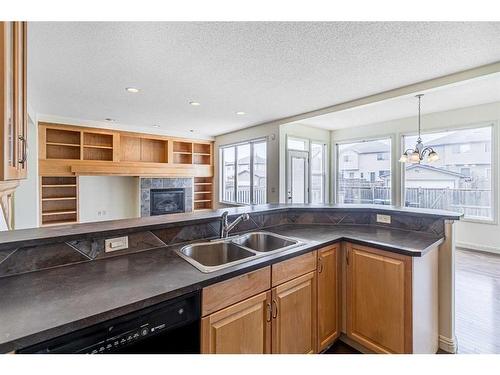 197 Coventry Hills Drive Ne, Calgary, AB - Indoor Photo Showing Kitchen With Fireplace With Double Sink