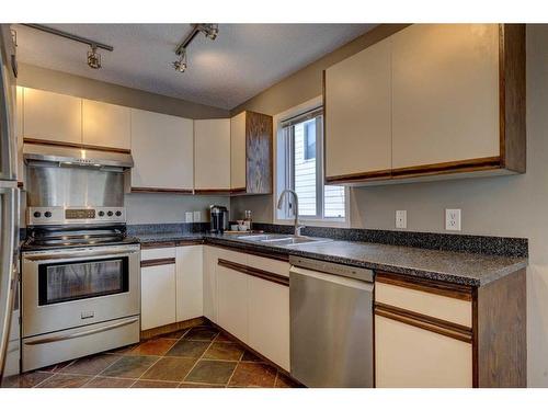 168 Riverbrook Road Se, Calgary, AB - Indoor Photo Showing Kitchen With Stainless Steel Kitchen With Double Sink
