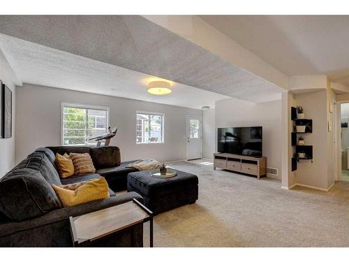 168 Riverbrook Road Se, Calgary, AB - Indoor Photo Showing Living Room