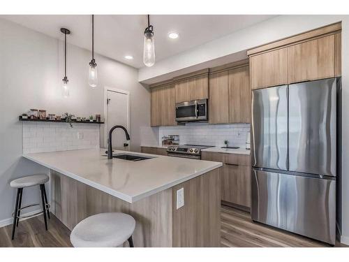 1210-220 Seton Grove Se, Calgary, AB - Indoor Photo Showing Kitchen With Stainless Steel Kitchen With Upgraded Kitchen