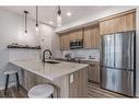 1210-220 Seton Grove Se, Calgary, AB  - Indoor Photo Showing Kitchen With Stainless Steel Kitchen With Upgraded Kitchen 