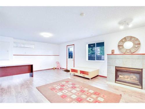 21 Panorama Hills Way Nw, Calgary, AB - Indoor Photo Showing Living Room With Fireplace