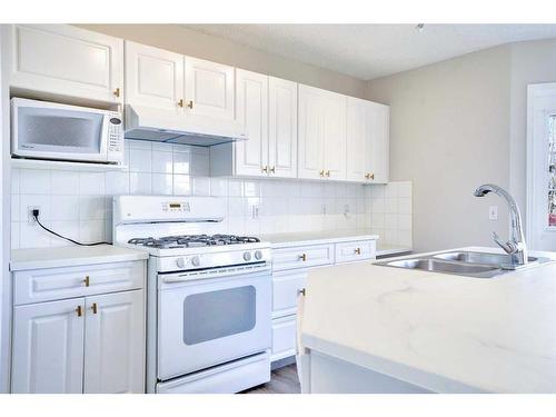 21 Panorama Hills Way Nw, Calgary, AB - Indoor Photo Showing Kitchen With Double Sink