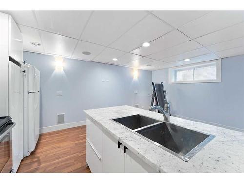 108 Silverado Plains View Sw, Calgary, AB - Indoor Photo Showing Kitchen With Double Sink