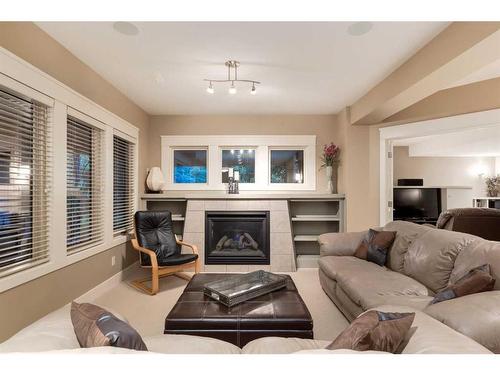 30 Discovery Ridge Manor Sw, Calgary, AB - Indoor Photo Showing Living Room With Fireplace