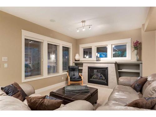 30 Discovery Ridge Manor Sw, Calgary, AB - Indoor Photo Showing Living Room With Fireplace