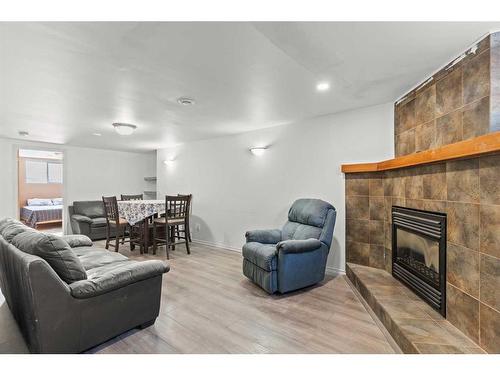 24 Trafford Place Nw, Calgary, AB - Indoor Photo Showing Living Room With Fireplace