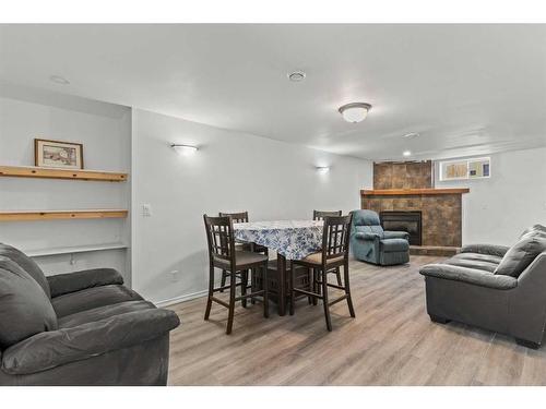 24 Trafford Place Nw, Calgary, AB - Indoor Photo Showing Living Room With Fireplace