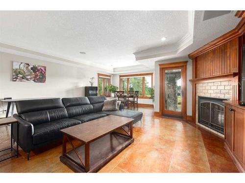 10-154029 264 Street West, Rural Foothills County, AB - Indoor Photo Showing Living Room With Fireplace