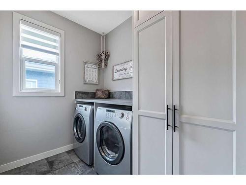 67 Cranbrook Way Se, Calgary, AB - Indoor Photo Showing Laundry Room