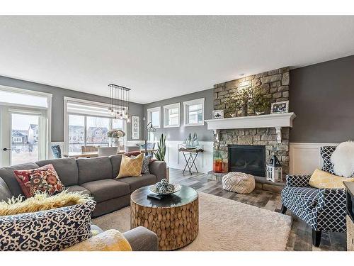 67 Cranbrook Way Se, Calgary, AB - Indoor Photo Showing Living Room With Fireplace