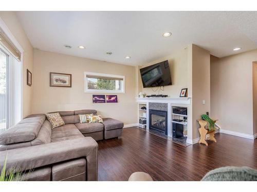 358 Sagewood Gardens Sw, Airdrie, AB - Indoor Photo Showing Living Room With Fireplace