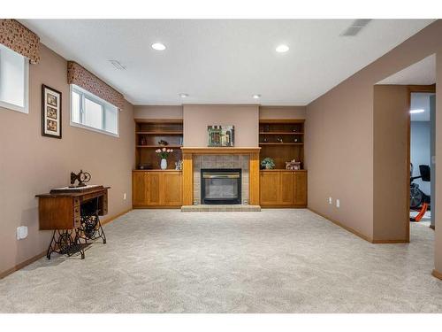 16 Somerside Common Sw, Calgary, AB - Indoor With Fireplace
