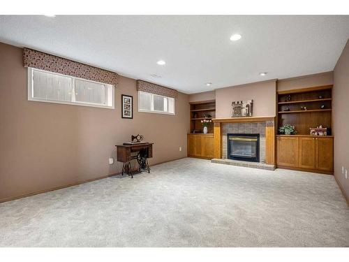 16 Somerside Common Sw, Calgary, AB - Indoor With Fireplace