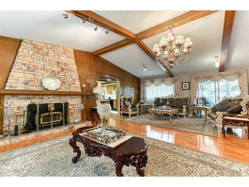 243083 16 Street East, Rural Foothills County, AB - Indoor Photo Showing Living Room With Fireplace