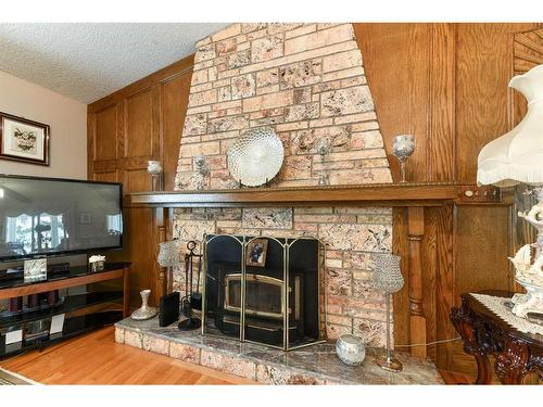 243083 16 Street East, Rural Foothills County, AB - Indoor Photo Showing Other Room With Fireplace