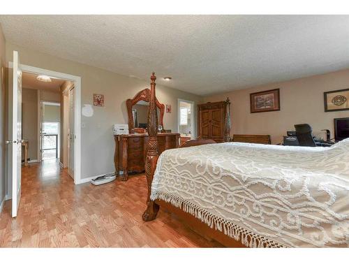 243083 16 Street East, Rural Foothills County, AB - Indoor Photo Showing Bedroom