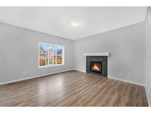 99 Red Embers Terrace Ne, Calgary, AB - Indoor Photo Showing Living Room With Fireplace