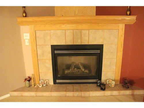 501 Shawinigan Drive Sw, Calgary, AB - Indoor Photo Showing Living Room With Fireplace