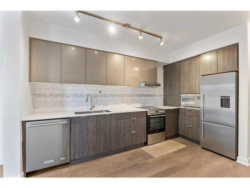 1607-930 6 Avenue Sw, Calgary, AB - Indoor Photo Showing Kitchen With Double Sink