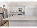 536 Walgrove Boulevard Se, Calgary, AB  - Indoor Photo Showing Kitchen With Stainless Steel Kitchen With Double Sink With Upgraded Kitchen 