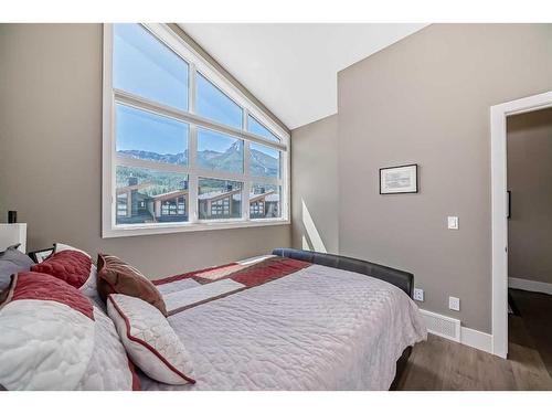 213 Riva Heights, Canmore, AB - Indoor Photo Showing Bedroom