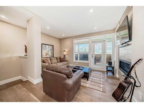 213 Riva Heights, Canmore, AB - Indoor Photo Showing Living Room With Fireplace