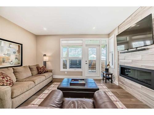 213 Riva Heights, Canmore, AB - Indoor Photo Showing Living Room With Fireplace