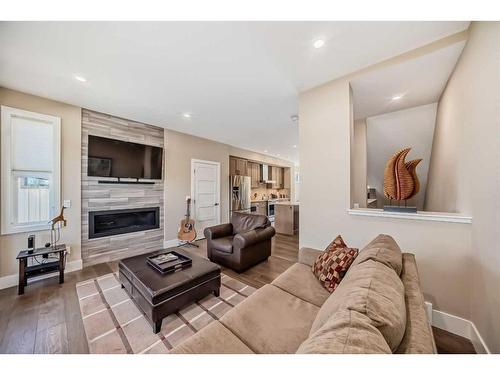 213 Riva Heights, Canmore, AB - Indoor Photo Showing Living Room With Fireplace