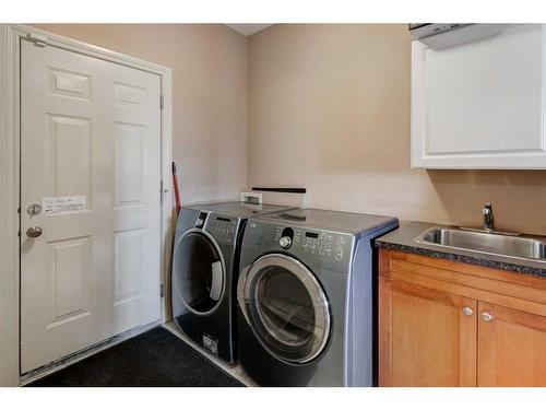 47 Glensummit Close, Cochrane, AB - Indoor Photo Showing Laundry Room