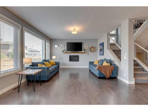 240 Sandpiper Crescent, Chestermere, AB - Indoor Photo Showing Living Room With Fireplace