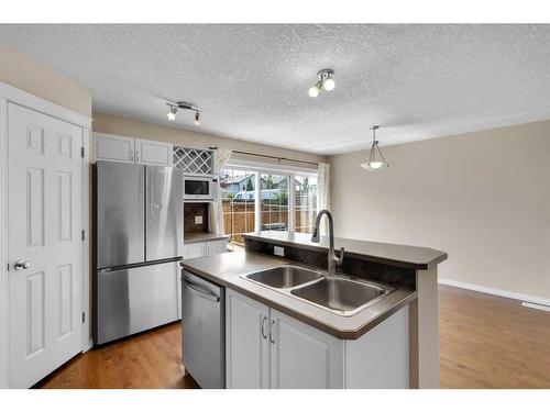 325 Eversyde Circle Sw, Calgary, AB - Indoor Photo Showing Kitchen With Double Sink