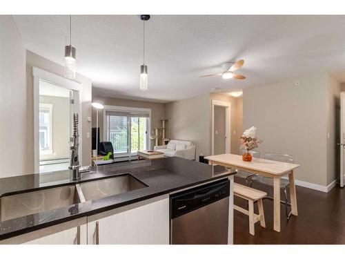 3419-11 Mahogany Row Se, Calgary, AB - Indoor Photo Showing Kitchen With Double Sink