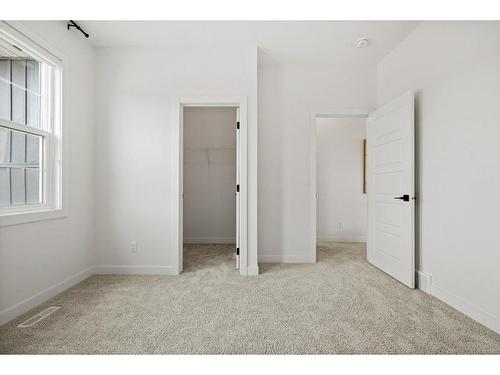 230 Creekside Way Sw, Calgary, AB - Indoor Photo Showing Other Room