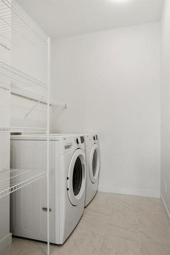 230 Creekside Way Sw, Calgary, AB - Indoor Photo Showing Laundry Room