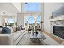 230 Creekside Way Sw, Calgary, AB  - Indoor Photo Showing Living Room With Fireplace 