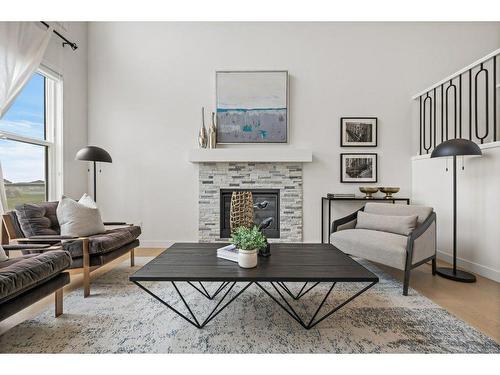 230 Creekside Way Sw, Calgary, AB - Indoor Photo Showing Living Room With Fireplace