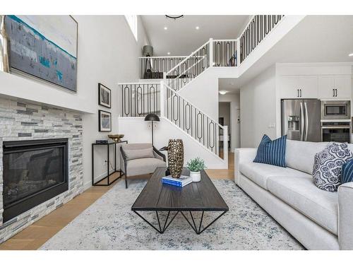 230 Creekside Way Sw, Calgary, AB - Indoor Photo Showing Living Room With Fireplace