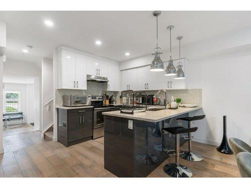 101-1632 20 Avenue Nw, Calgary, AB - Indoor Photo Showing Kitchen With Upgraded Kitchen