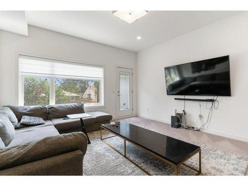 101-1632 20 Avenue Nw, Calgary, AB - Indoor Photo Showing Living Room