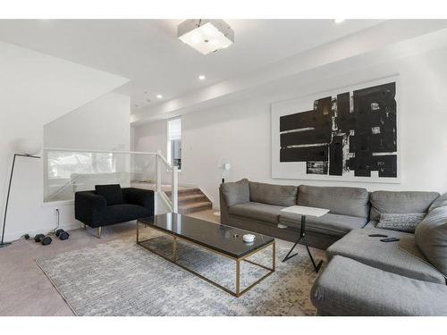 101-1632 20 Avenue Nw, Calgary, AB - Indoor Photo Showing Living Room