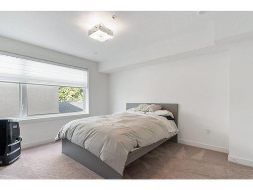 101-1632 20 Avenue Nw, Calgary, AB - Indoor Photo Showing Bedroom