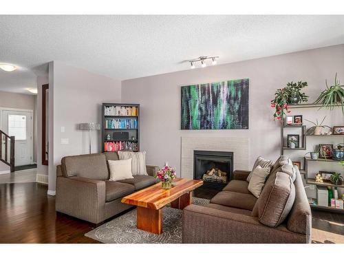 23 Panton Way Nw, Calgary, AB - Indoor Photo Showing Living Room With Fireplace