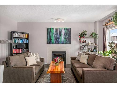 23 Panton Way Nw, Calgary, AB - Indoor Photo Showing Living Room With Fireplace