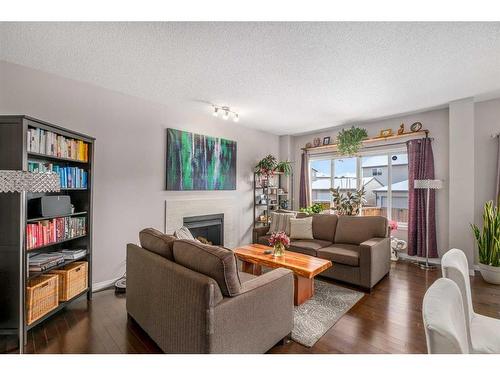 23 Panton Way Nw, Calgary, AB - Indoor Photo Showing Living Room With Fireplace