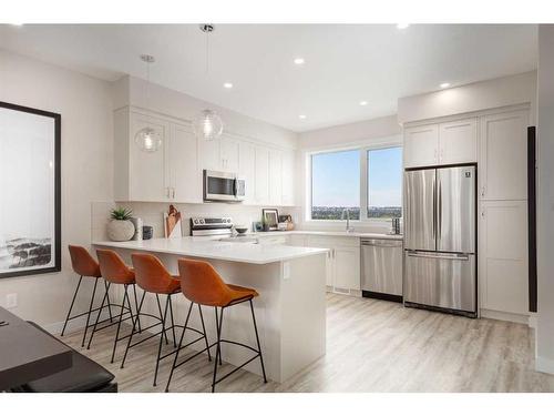 84-1453 Na'A Drive Sw, Calgary, AB - Indoor Photo Showing Kitchen With Stainless Steel Kitchen With Upgraded Kitchen