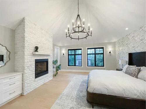 4308 Coronation Drive Sw, Calgary, AB - Indoor Photo Showing Bedroom With Fireplace