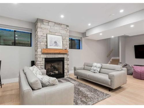 4308 Coronation Drive Sw, Calgary, AB - Indoor Photo Showing Living Room With Fireplace