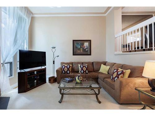 4-10457 19 Street Sw, Calgary, AB - Indoor Photo Showing Living Room